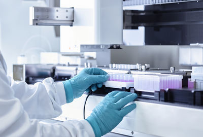 Scientist examining medical sample in laboratory