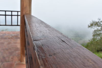 Close-up of wood against sky