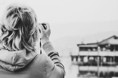 Rear view of woman against sky