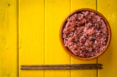 Close-up of yellow bread on wood