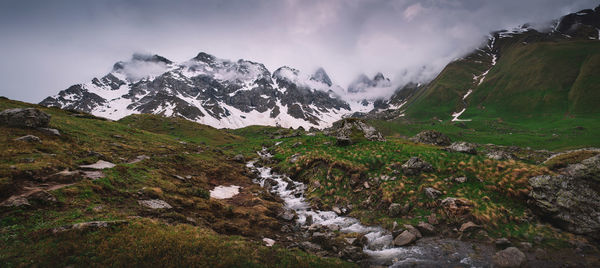 Scenic view of mountains against sky during winter