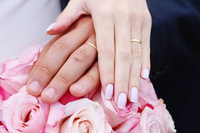 Close-up of couple holding hands