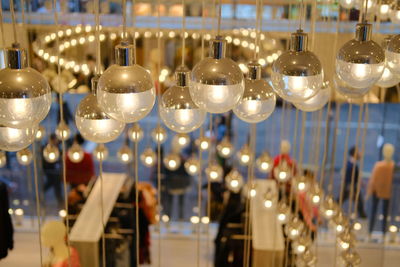 View of illuminated lights hanging from ceiling