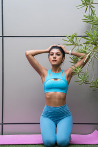 Young woman stretching outdoors