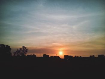 Silhouette landscape against sky during sunset