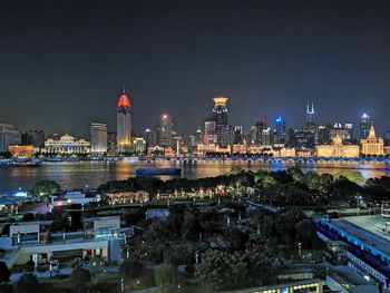 Illuminated buildings in city at night
