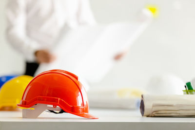 Close-up of red working on table