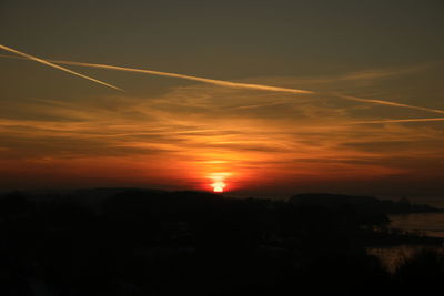 Scenic view of silhouette landscape against sky during sunset