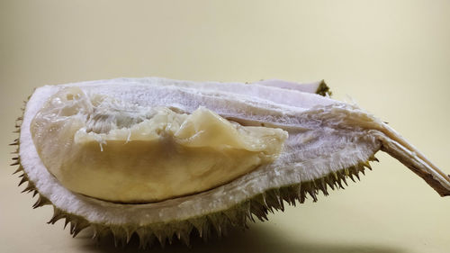 Close-up of bananas on table against white background