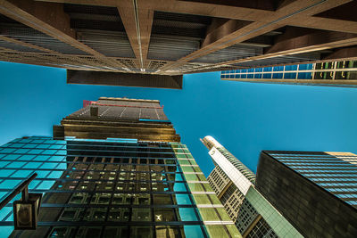 Low angle view of modern building against clear blue sky