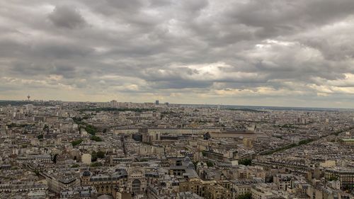 High angle view of city against cloudy sky