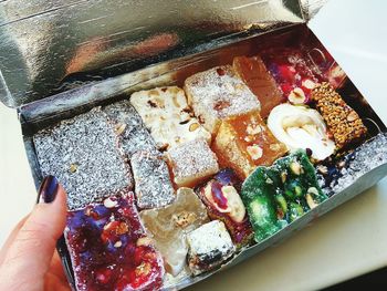 Close-up of hand holding ice cream