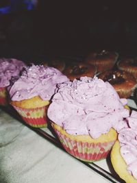 Close-up of pink rose on table