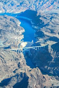 High angle view of snowcapped mountains and water - hoover dam