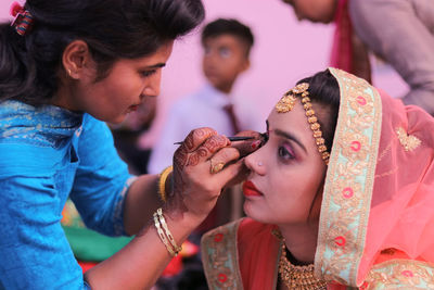 Woman grooming bride