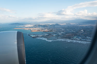 Aerial view of cityscape against sky