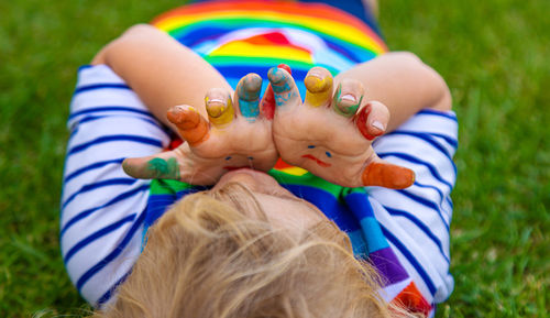 High angle view of boy playing with baby