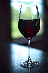 Close-up of wineglass on table