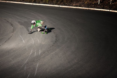 High angle view of man longboarding on road