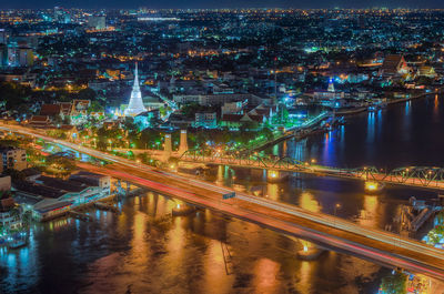 High angle view of illuminated city buildings at night