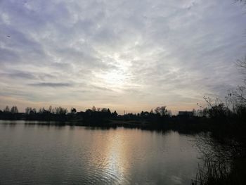 Scenic view of lake against sky during sunset