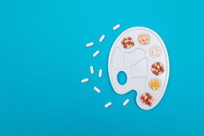 High angle view of drink against blue background