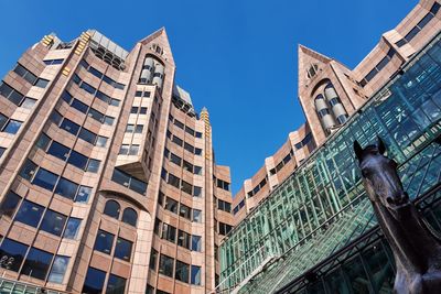 Low angle view of buildings against clear sky