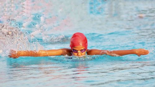 Portrait of woman swimming in pool