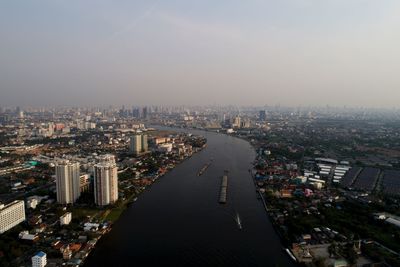High angle view of city lit up at night