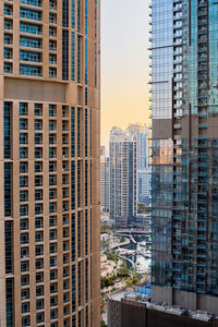 Modern architecture of a skyscraper with a large number of balconies against the background 