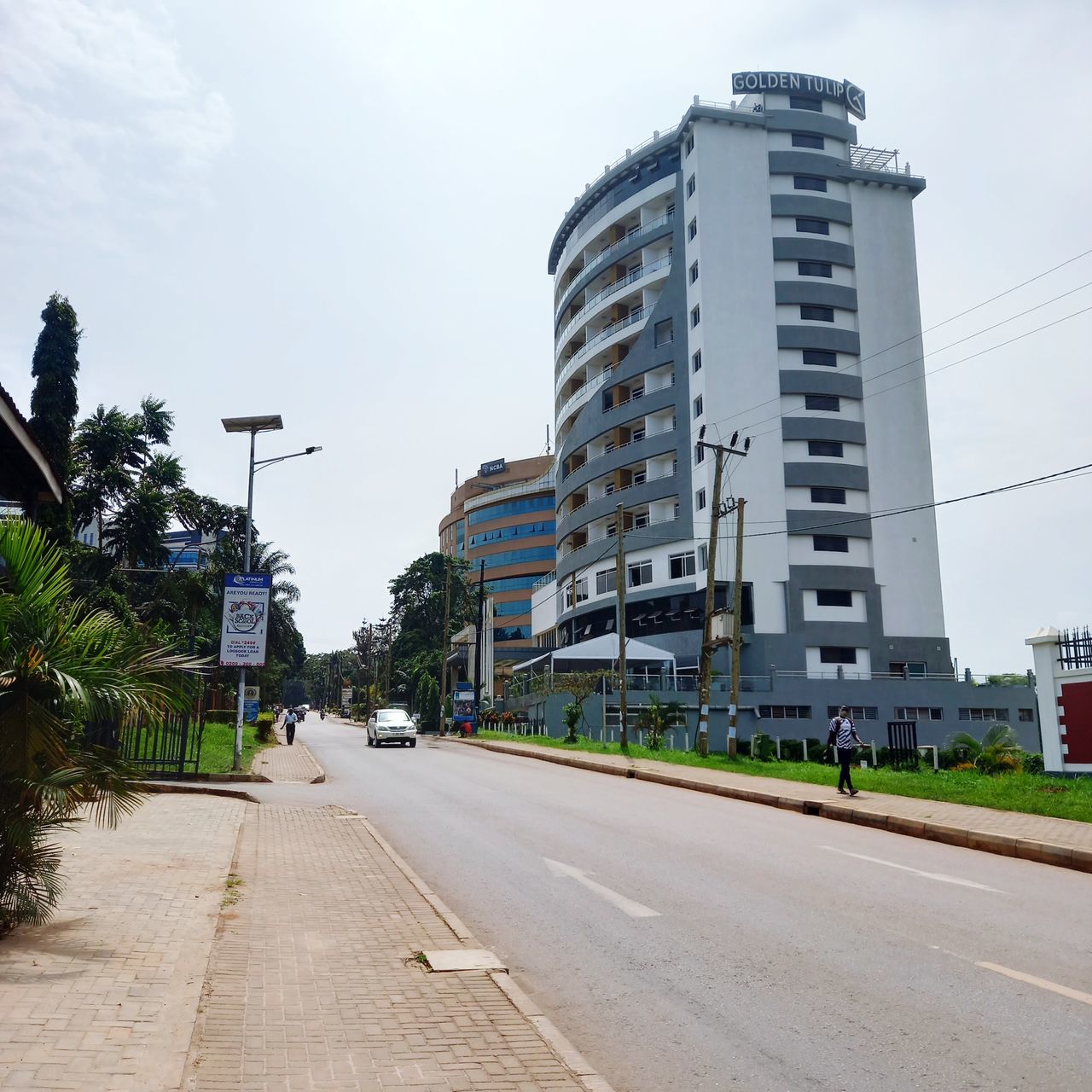 VIEW OF CITY STREET AGAINST SKY