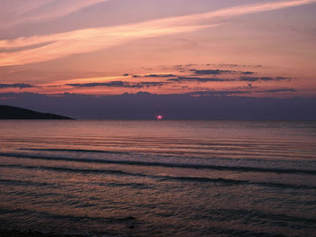 Scenic view of sea against orange sky