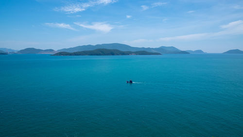 Scenic view of sea against blue sky