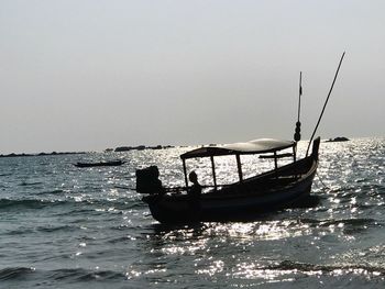 Boat on sea against clear sky