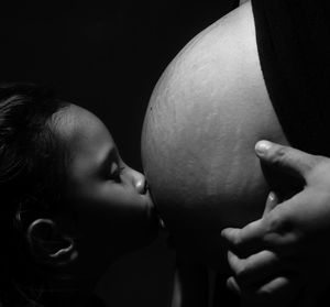 Close-up of hands touching woman