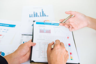 Cropped image of man working on table