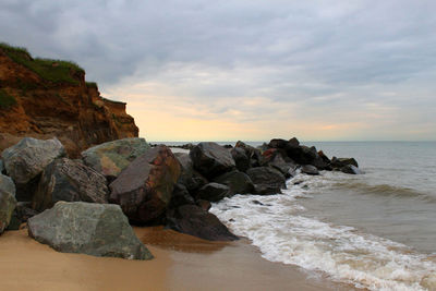 Scenic view of sea against cloudy sky