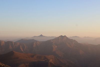 Scenic view of mountains against sky during sunset
