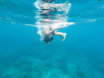 Man swimming in pool