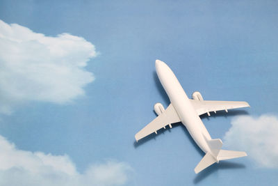 Close-up of model airplane on sky patterned table