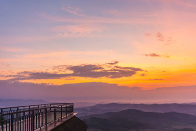 Scenic view of sea against romantic sky at sunset