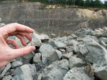 Close-up of hand holding stones