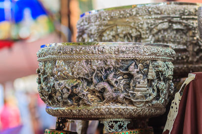 Close-up of antiques for sale at store 