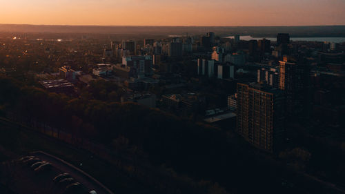 High angle view of buildings against sky during sunset