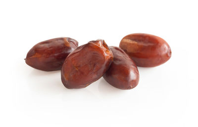 Close-up of fruits against white background