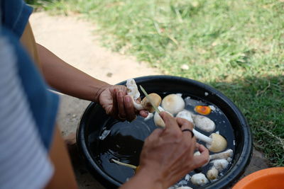 Midsection of person preparing food