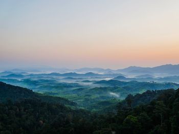 Scenic view of mountains against sky during sunset