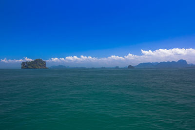 Scenic view of sea against blue sky