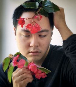 Close-up of man holding rose bouquet