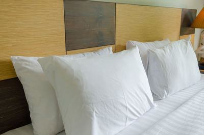 White pillows on bed in hotel room